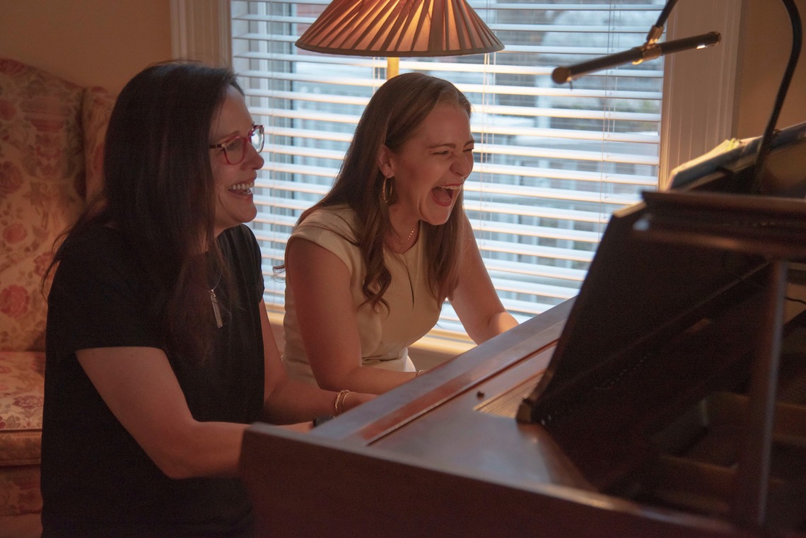 President Jacqueline Edmondson and visiting opera singer Megan Marino perform a piano duet of a Brahms waltz.
