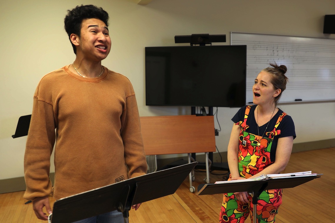 Dylan Cao reaches for a high note during a rehearsal with visiting opera singer Megan Marino.