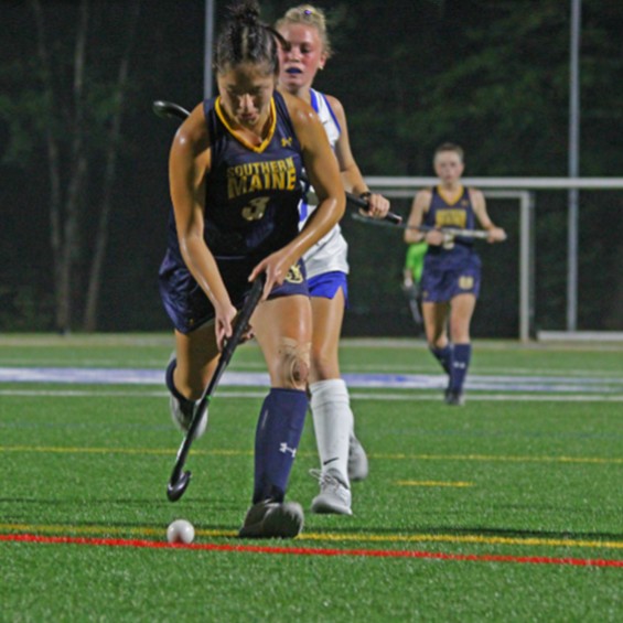 Haley-Jane Tuplin stays a step ahead of her defender in a field hockey game.