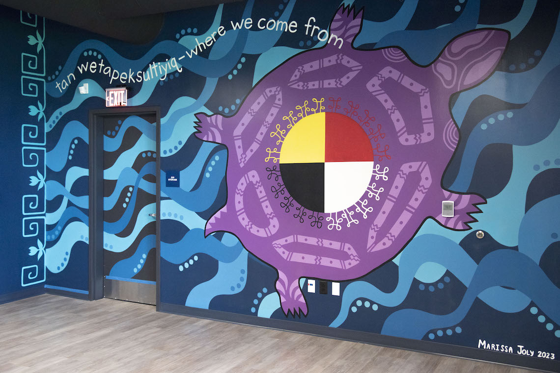 The mural by Marissa Joly on the second floor of the McGoldrick Center is called "tan wetapeksultiyiq - where we come from."