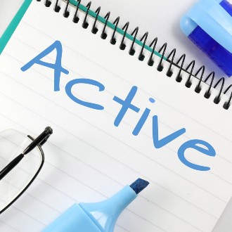 A lined notepad wiht the word "active" written in blue marker