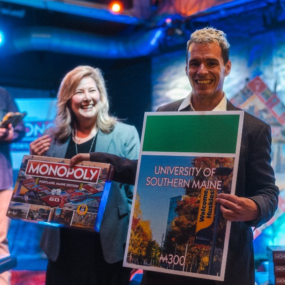 At an event to unveil a Portland-based edition of the board game Monopoly, the USM Foundation's Andrew Bossie stepped up to accept the property where USM will be featured.