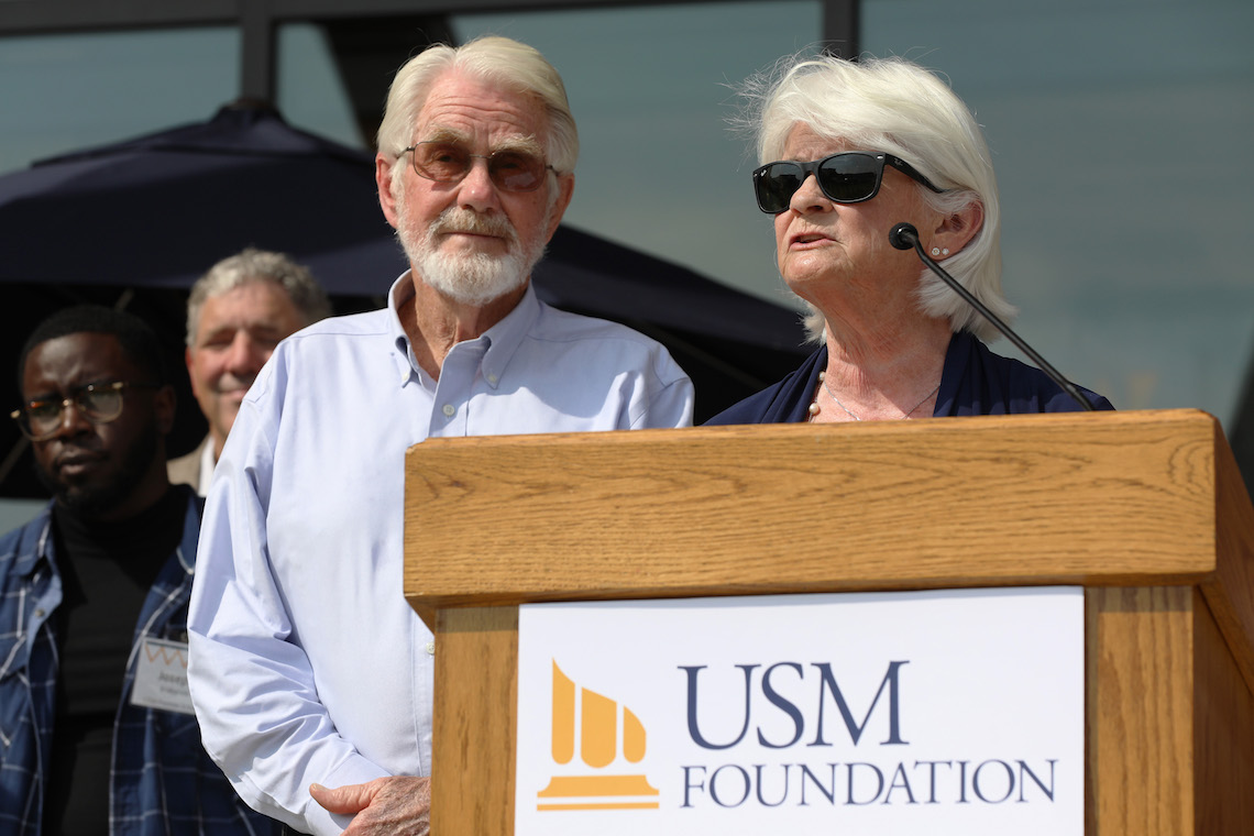 Dick and Carolyn McGoldrick speak at the ribbon-cutting ceremony for the McGoldrick Center.