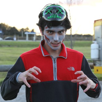 Members of the track and cross country teams don makeup and masks to scare willing victims at the annual Zombie Run.