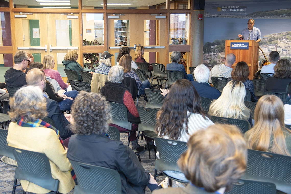 A crowd gathered in the University Events Room at Glickman Library to hear Maurice Manning read and discuss his writing during the 2023 O'Brien Poetry Event.