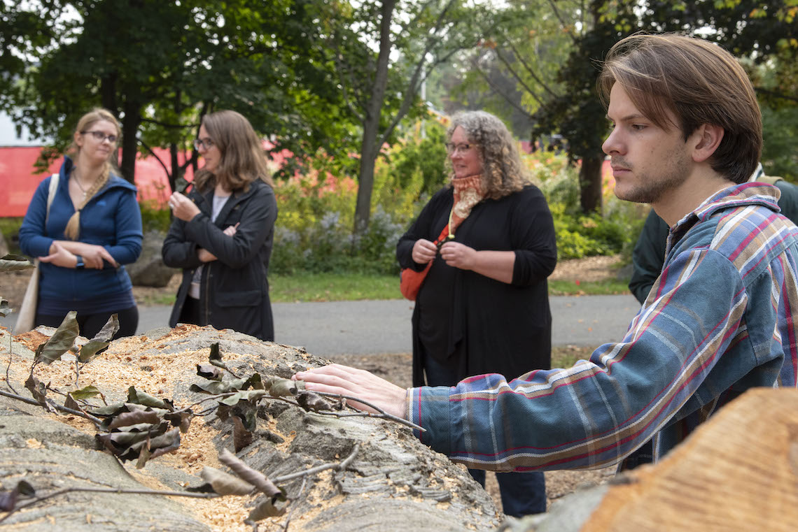 A vigil gave members of the campus community a chance to bid farewell to the beech tree that once stood in front of Luther Bonney Hall.
