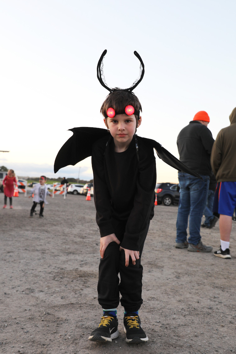A costume with battery-powered eyes helps flush out anyone hiding in the shadows at the Zombie Run.