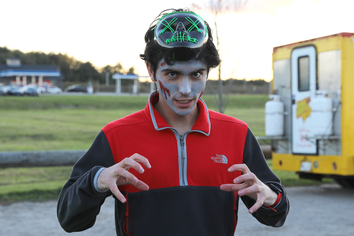 Members of the track and cross country teams don makeup and masks to scare willing victims at the annual Zombie Run.