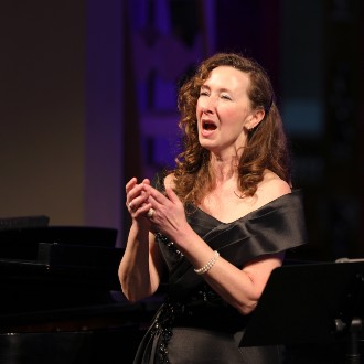 Dr. Malinda Haslett sings music by Claude Arrieu in a concert at the Franco Center in Lewiston.