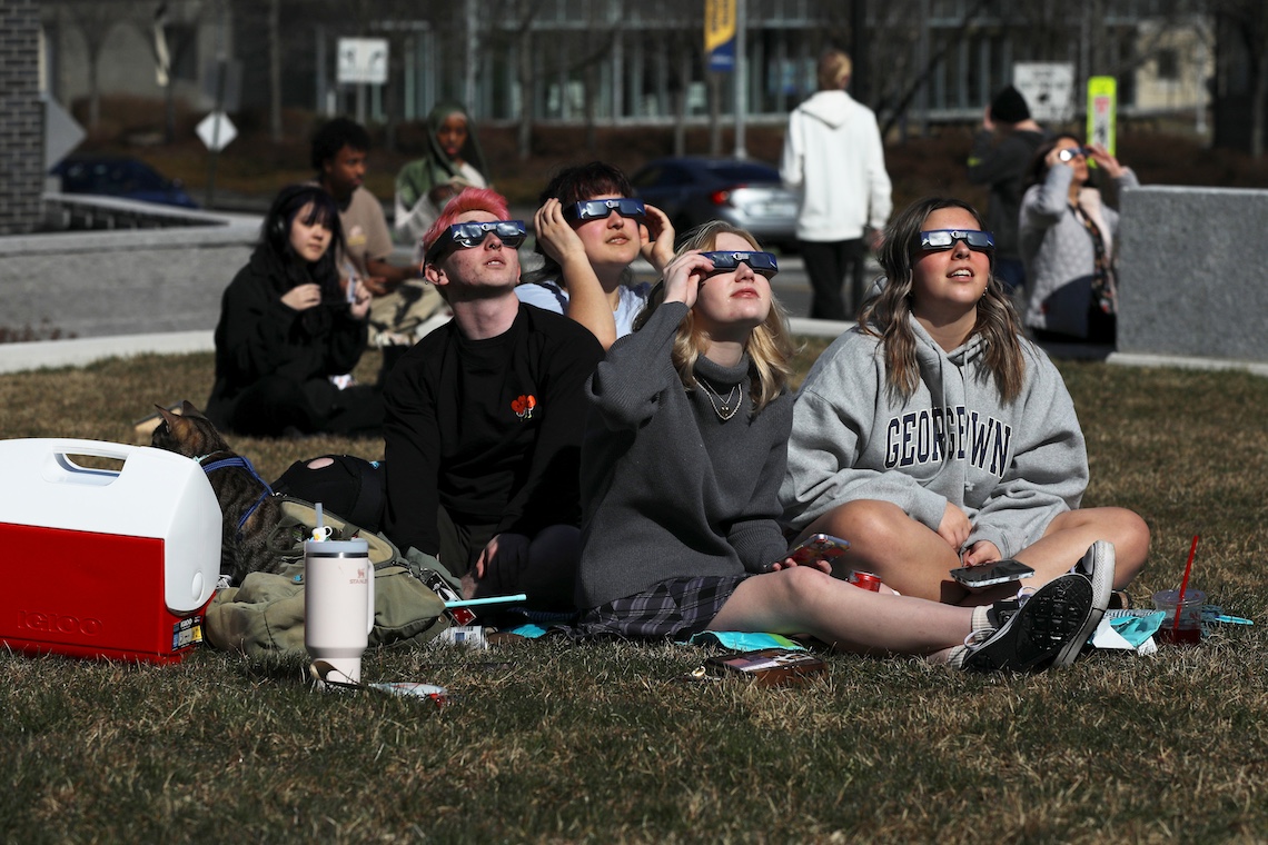A blanket for seating on the Bean Green helped ward off moisture from the recent snow melt for viewers of the eclipse on April 8.