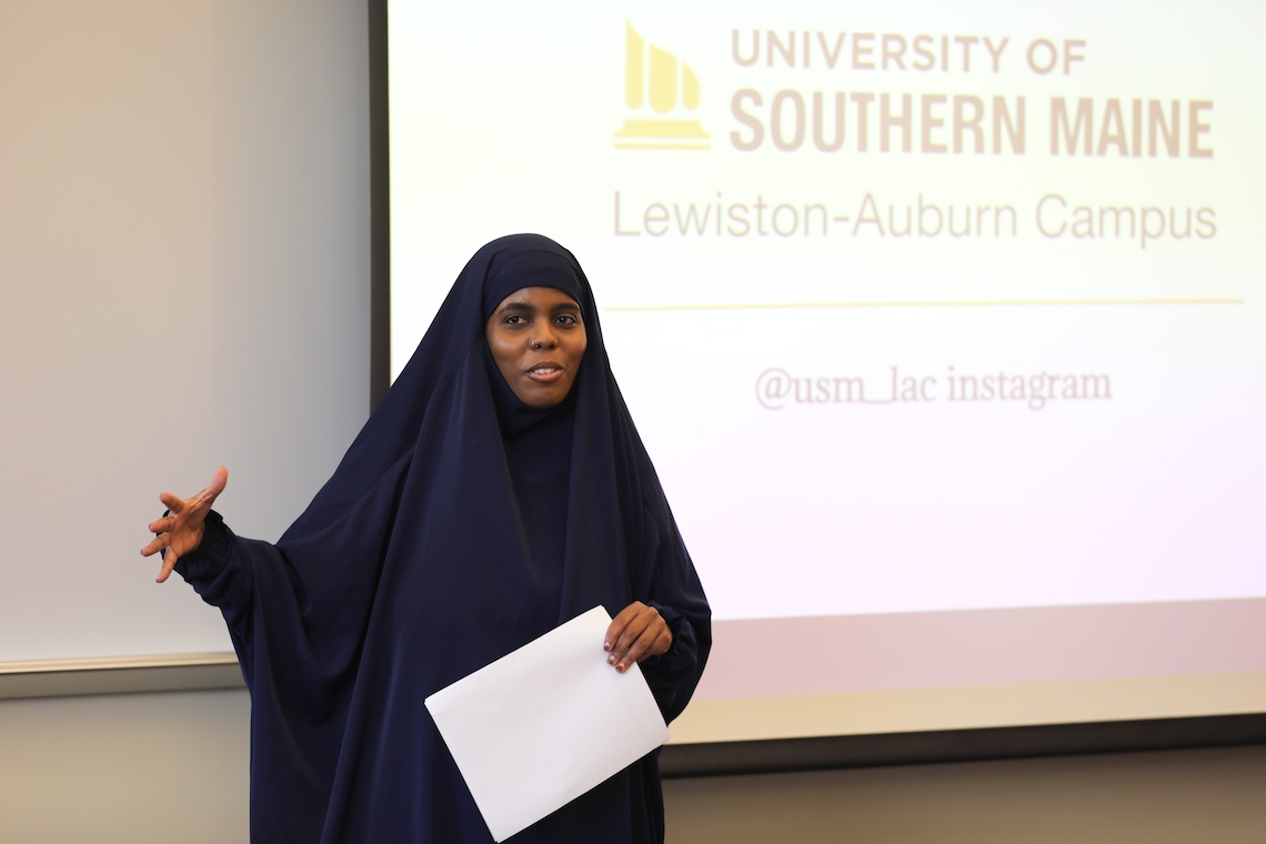 Amran Osman talks about her experience as an immigrant navigating the education system during a presentation of the Gateways for Growth report.