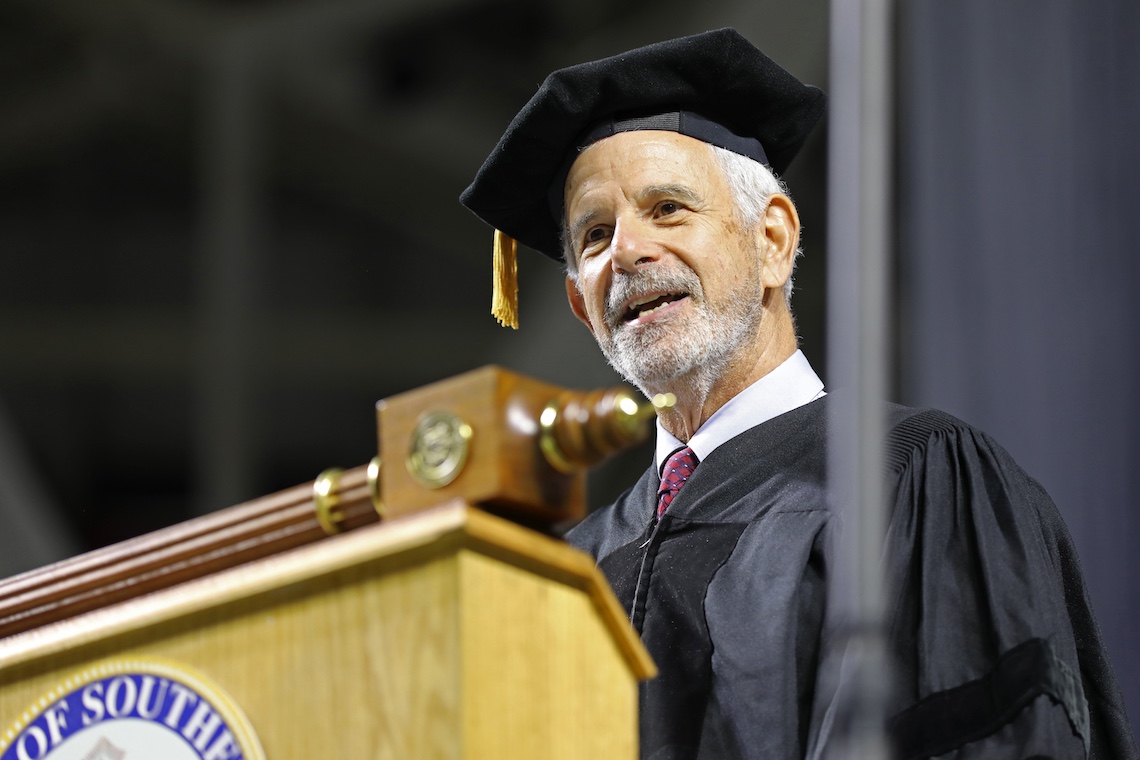 UMaine System Board of Trustees member Roger Katz speaks at the 2024 Commencement ceremony.