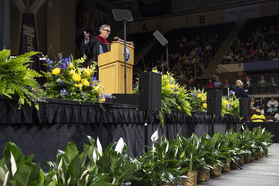 Tom Caron delivers the keynote speech at the 2024 Commencement ceremony.