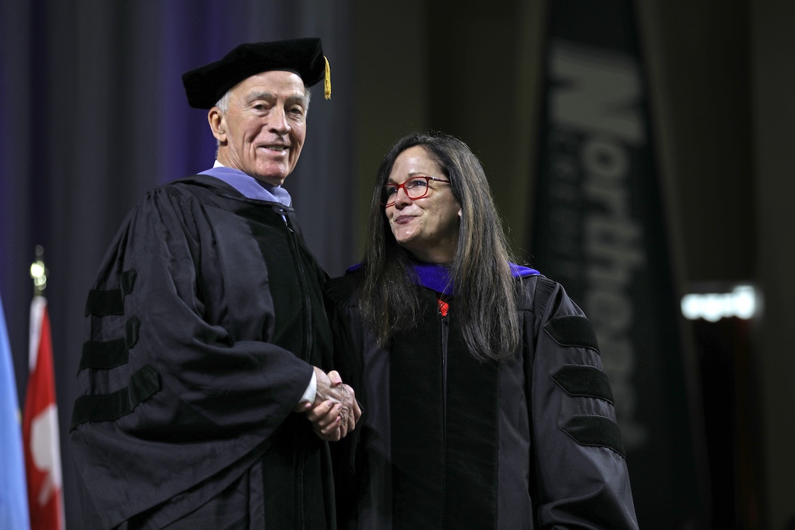 President Edmondson congratulates Joe Wishcamper after presenting him with an honorary degree at the 2024 Commencement ceremony.