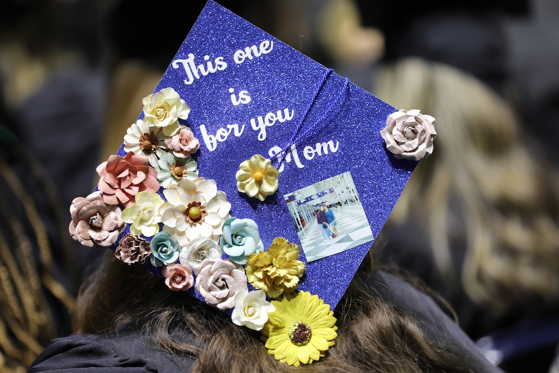 A mortar board is decorated with the message "This one is for you Mom" at the 2024 Commencement ceremony.