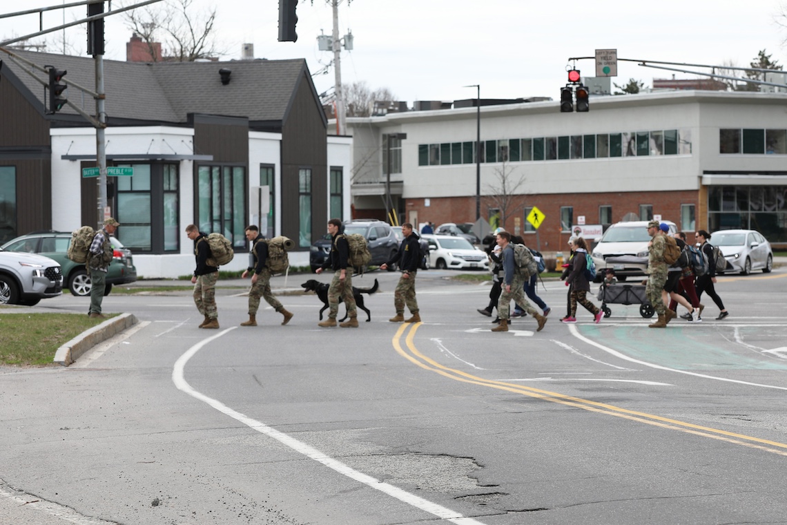 Walkers cross Baxter Boulevard in Portland as they begin a military-style ruck around Back Cove in memory of Sgt. Christopher Gelineau.