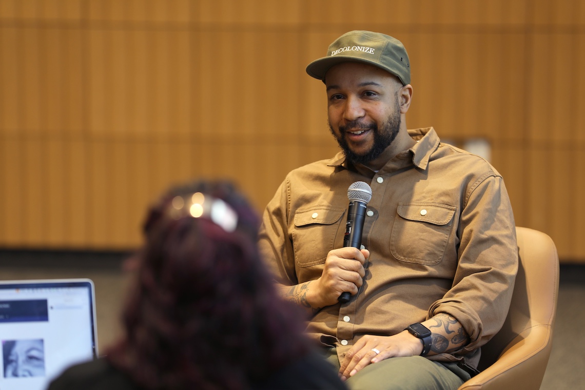 2024 artist-in-residence Ryan Adams answers questions from USM Director of Art Exhibitions and Outreach Kat Zagaria Buckley at a forum in the McGoldrick Center.