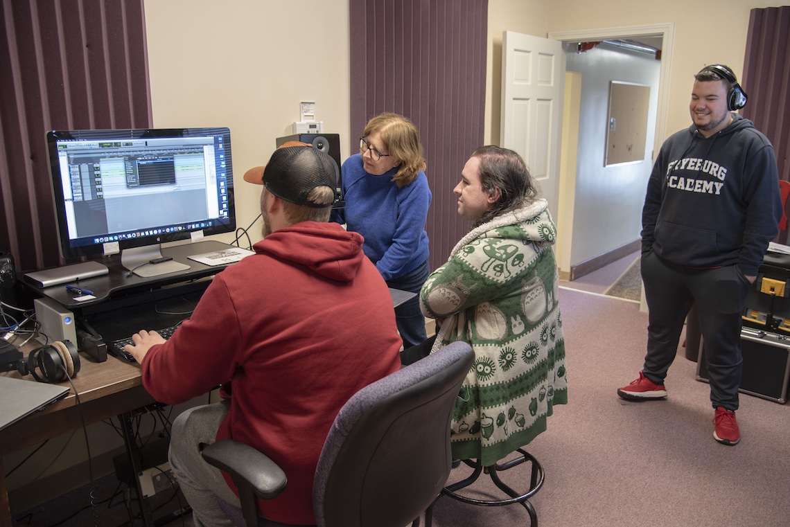 Jessica Lockhardt guides students through the editing process in the new campus sound studio.