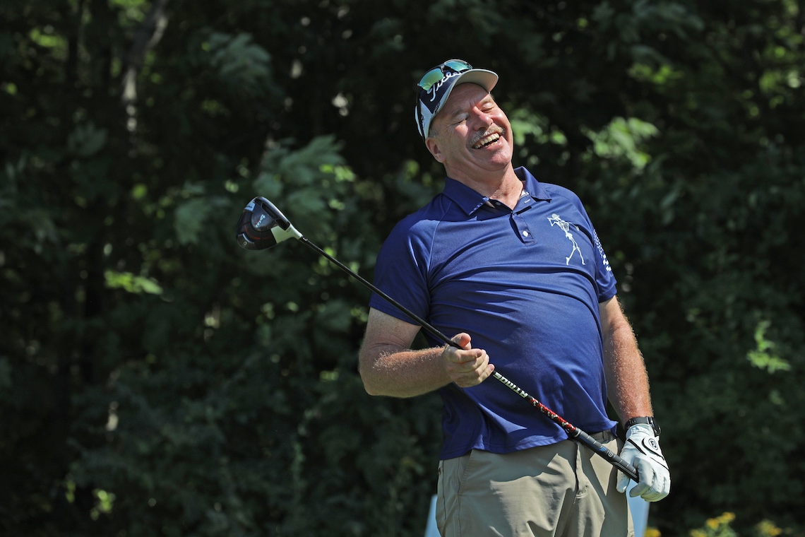 A tee shot gets a happy reaction from a golfer at the 2024 Husky Golf Classic.