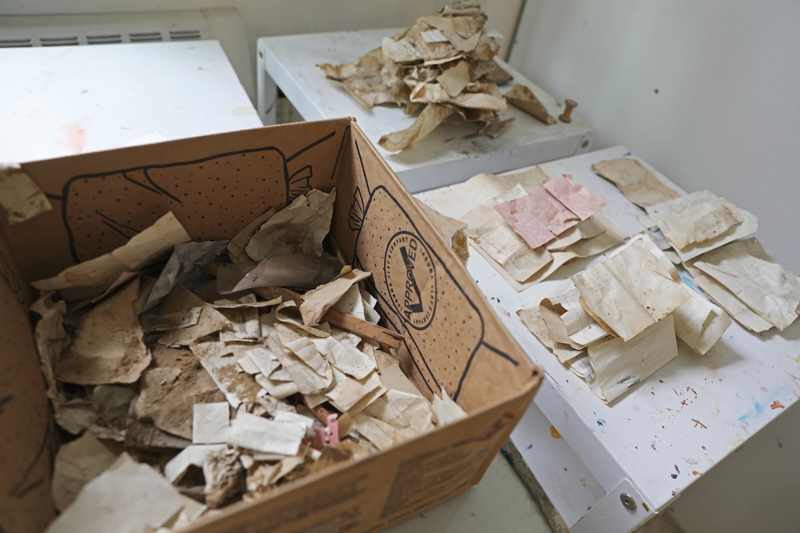 Dozens of notes that were found in the walls of the Academy Building as part of a renovation project were collected in a cardboard box.