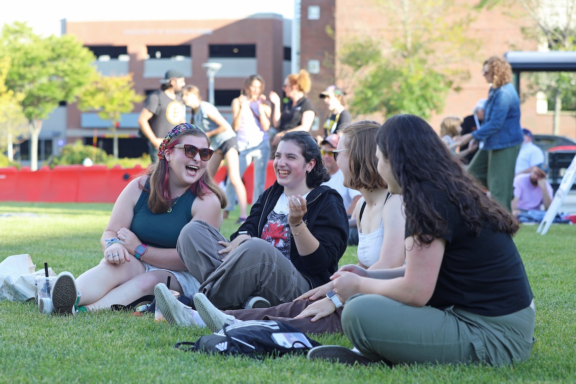 Students share a laugh as they take in the music of the McGoldROCKS concert.