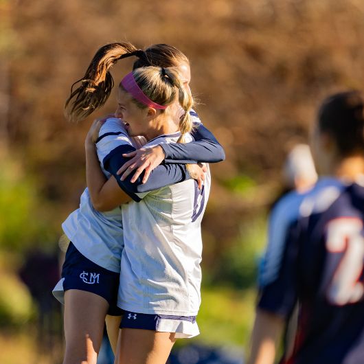 Catriona Gould and Julia McKenna celebrate Gould's game-opening goal in USM's 3-0 victory over WestConn for the Little East Conference Championship. (Courtesy: James Liebowitz)