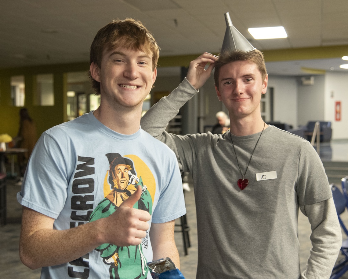 Jesse Murphy (left) and Jared Lennon demonstrate their brains and heart at the listening party for "The Wizard of Oz" radio show.