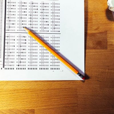 Pencil sitting on top of a scantron page