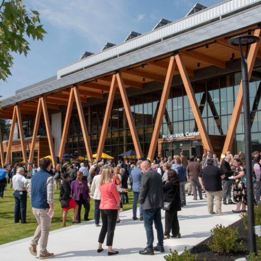 A crowd gathers ahead of the ribbon-cutting ceremony at the McGoldrick Center.