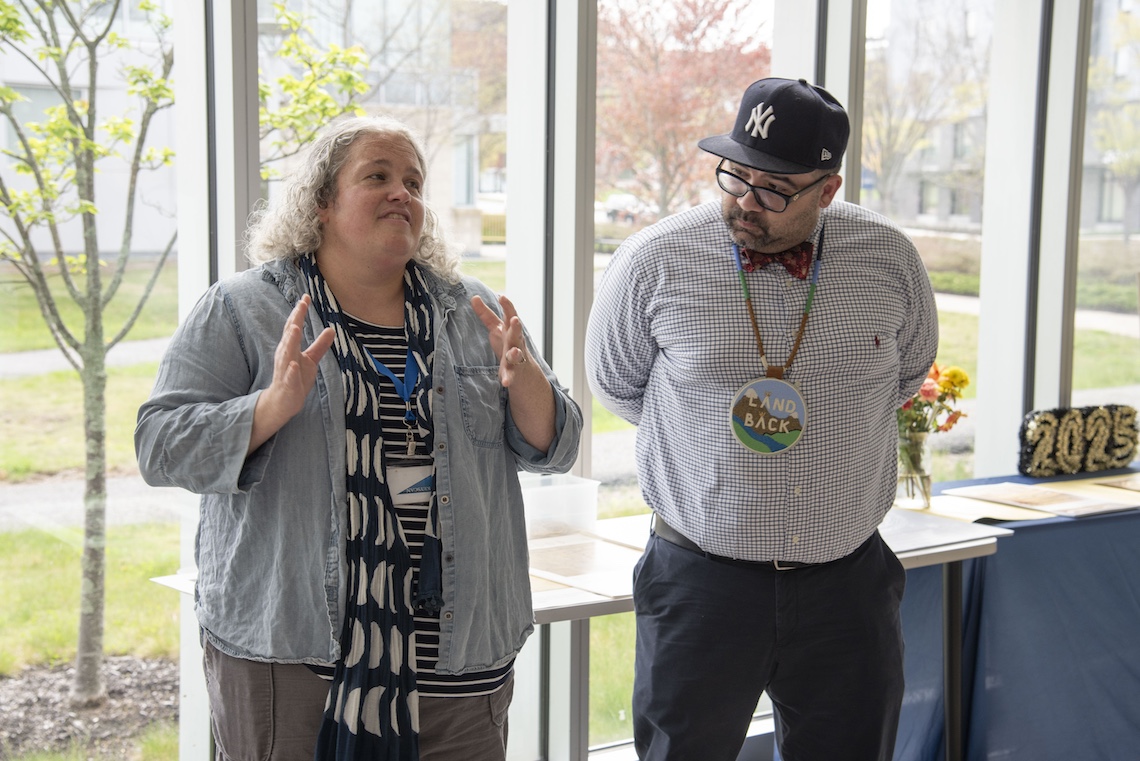 Drs. Libby Bischof and David Lowry welcome visitors to the opening reception of the Osher Map Library's "A World On Display" exhibition.