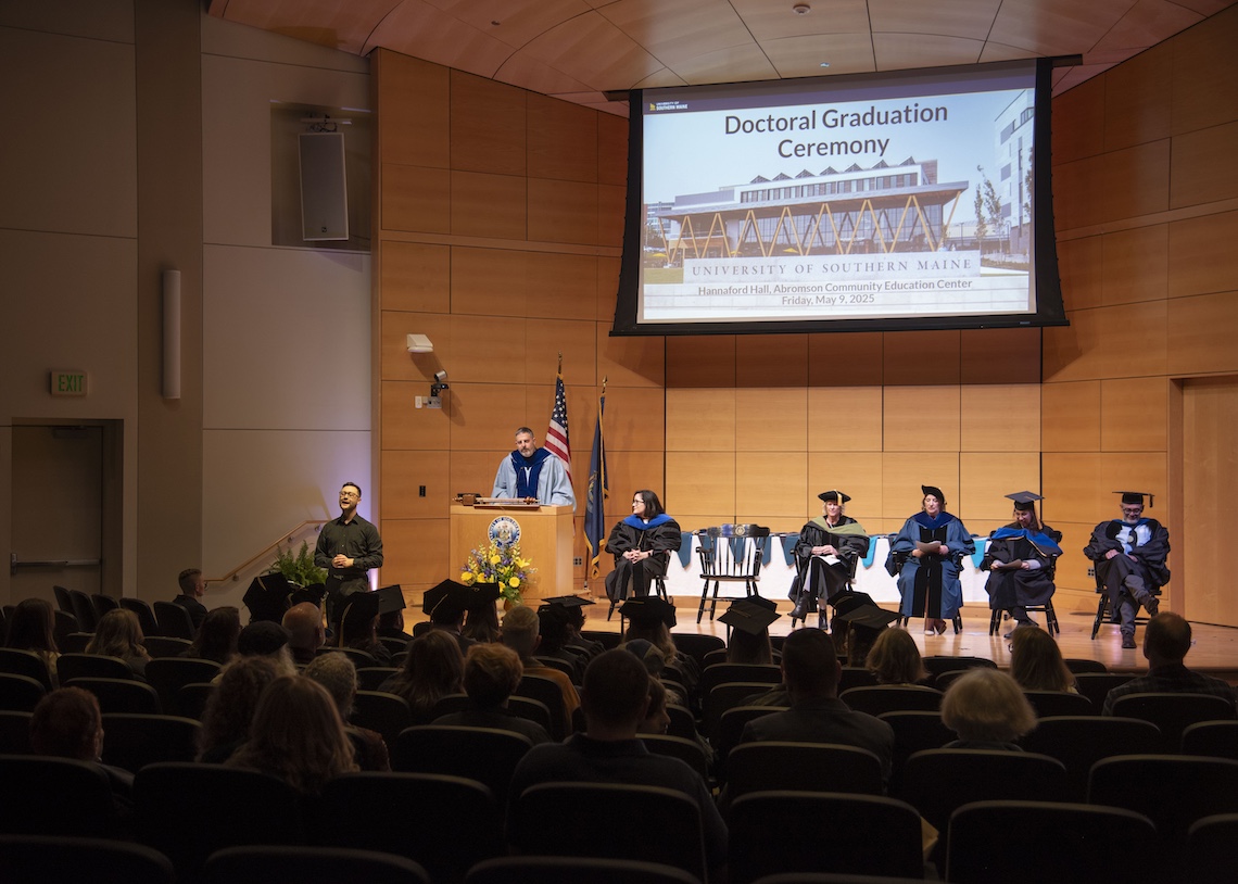 Provost Adam Tuchinsky offers his congratulations at the 2025 hooding ceremony for PhD graduates.