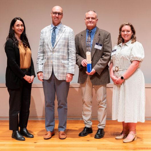 Dr. Dana Kerr (second from right) accepts the inaugural MEMIC Mission Award for Industry Leadership.