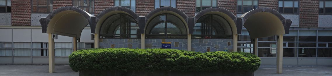 A quiet summer day at the entrance to Upton-Hastings Hall in Gorham.