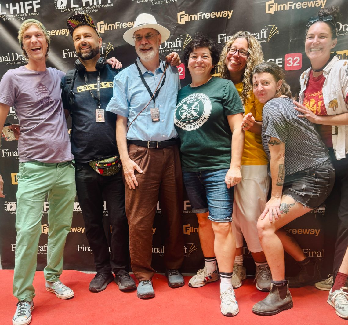 Director Tom Bell stands center, to the right of him is Producer Annella Linton. Group poses for red carpet photo at Love and Hope International Film Festival in Barcelona.