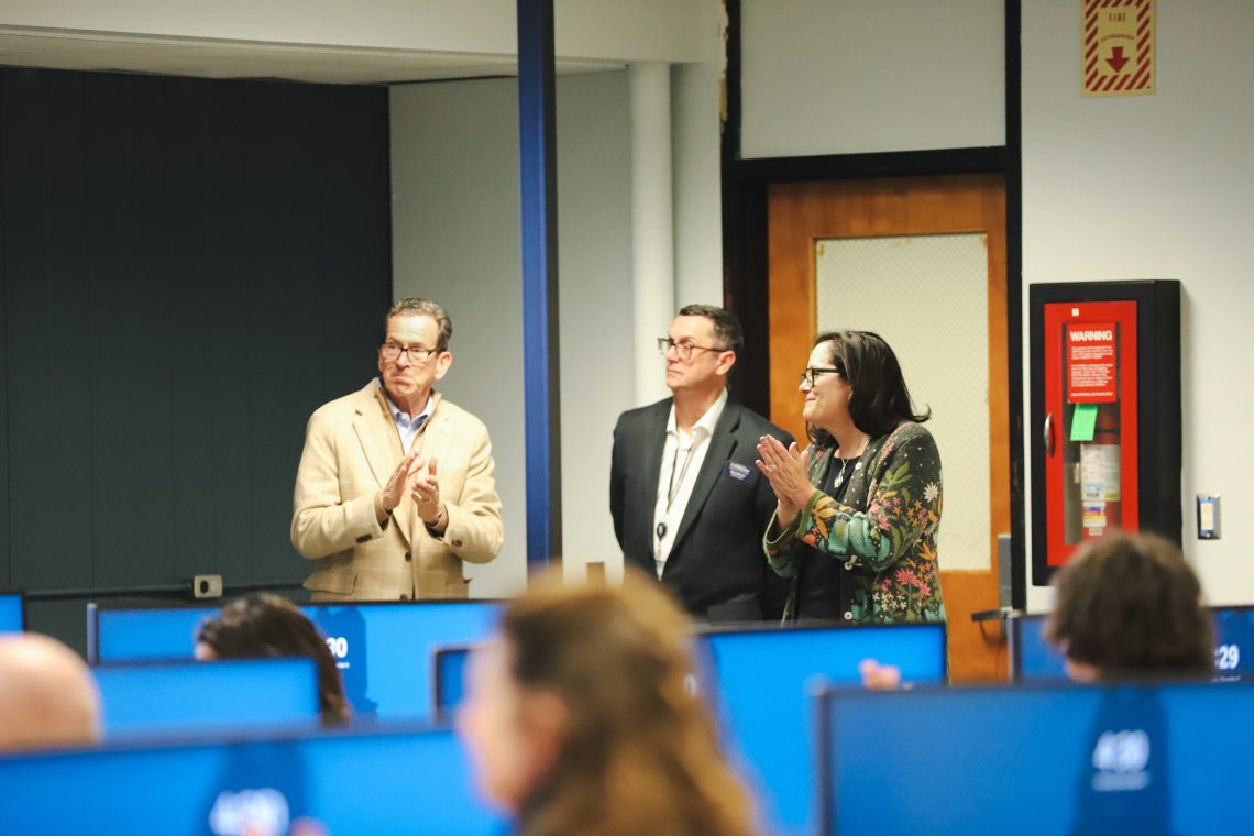 From left to right: Chancellor Dannel Malloy, USM Professor Mark Monnin, and USM President Jacqueline Edmondson applaud speaker at new SOC Cybersecurity Classroom Ribbon Cutting.