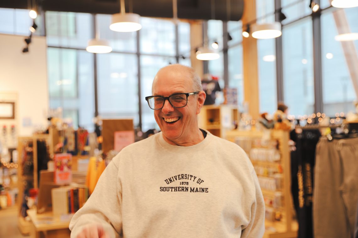 Vernon Tarbell smiles as friend walks by (not pictured)