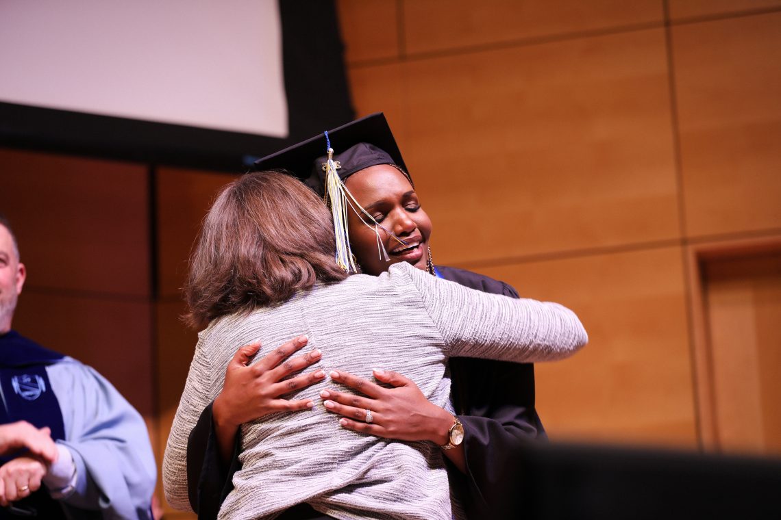 Ange Uwera Ndayisabye embraces Nancy Philbrick as she receives the Jane Philbrick Goldsworth Award for Excellence in Nursing.