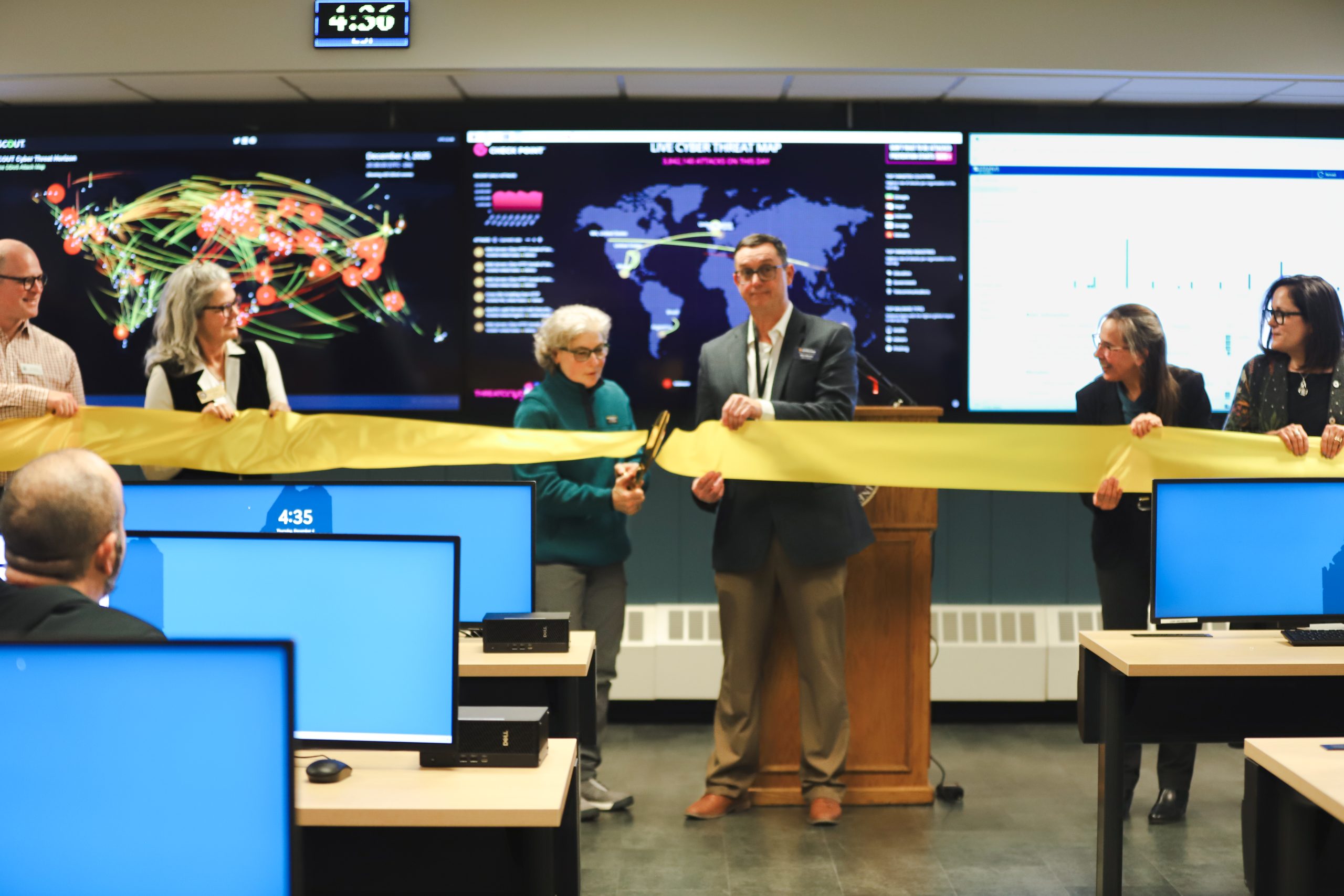 Lori Sussman cuts the ribbon at new SOC Cybersecurity Classroom Ribbon Cutting.