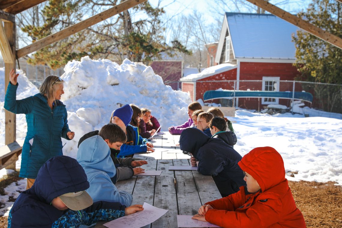 Becky Hallowell leads an outdoor lesson with students at Wiscasset Elementary School.