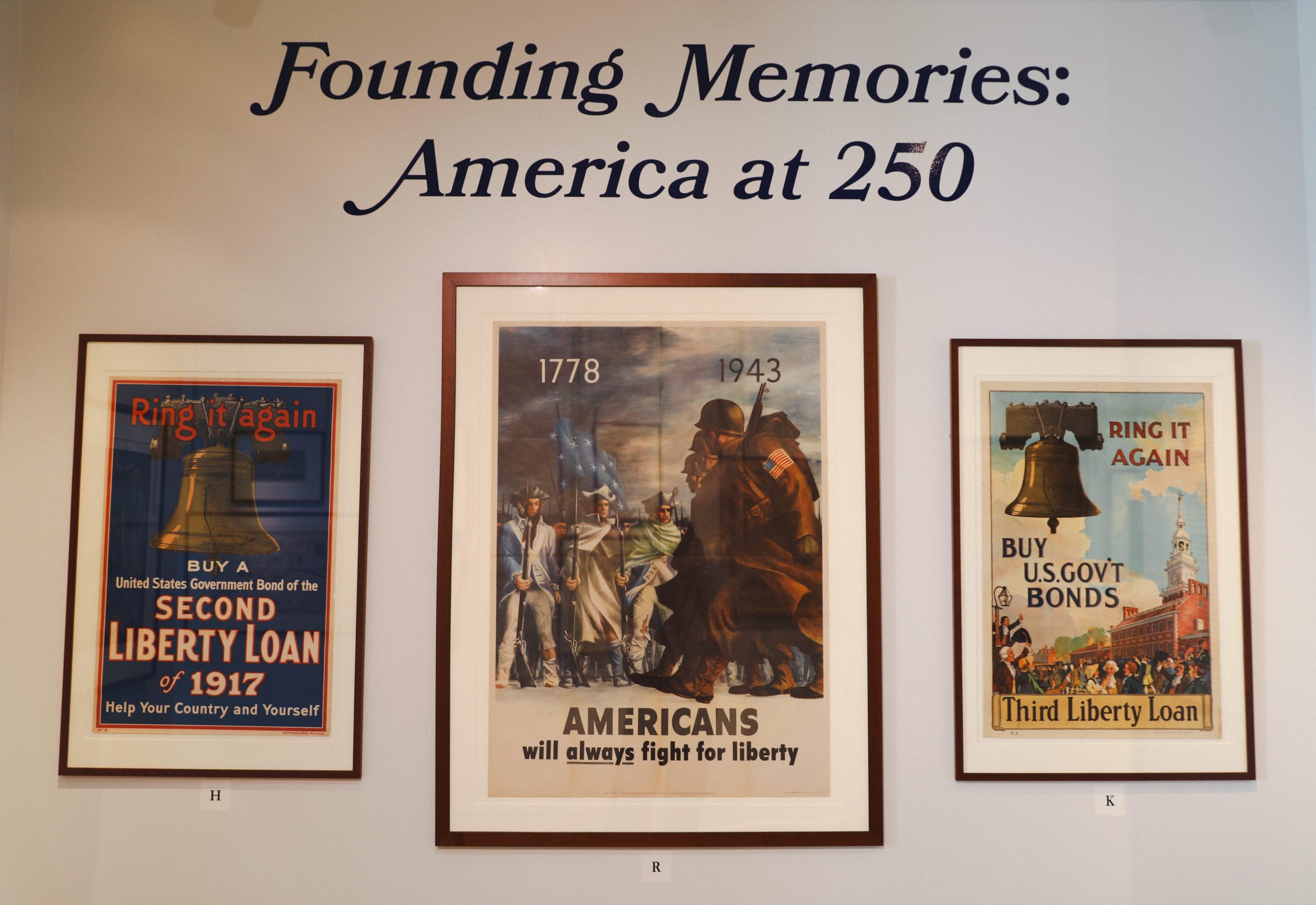 Exhibition title wall with framed historical political prints in the Osher Map Library.