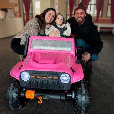 Aleigh, Atlas, and John showing off their new mobility optimized Jeep designed by Occupational Therapy and Engineering for Go Baby Go.