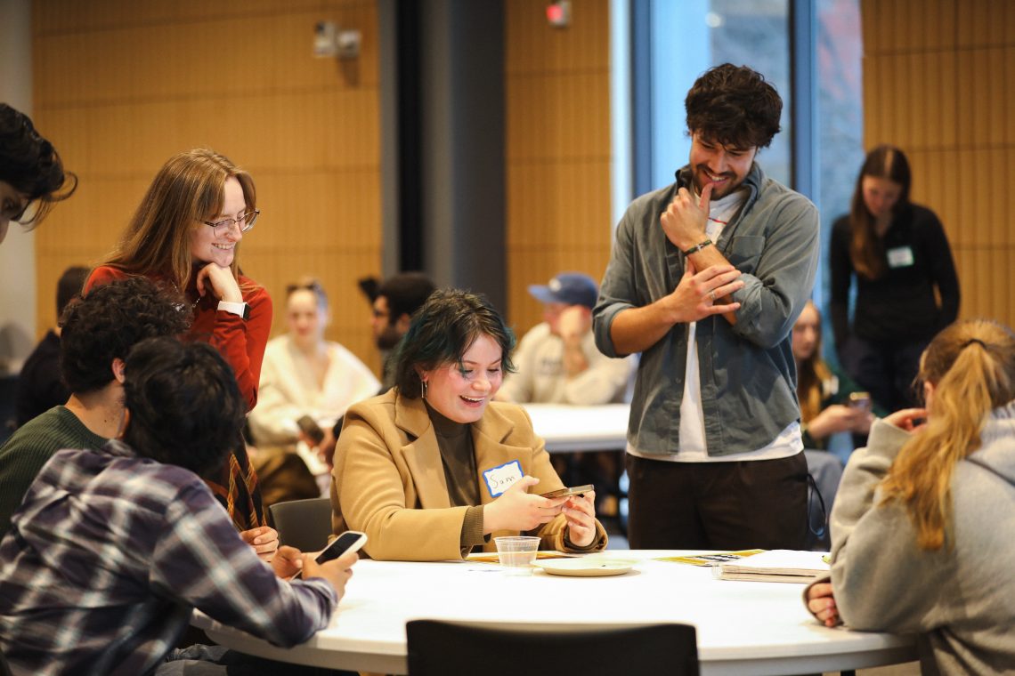 Students laugh together during interactive workshop at innovation challenge kickoff event