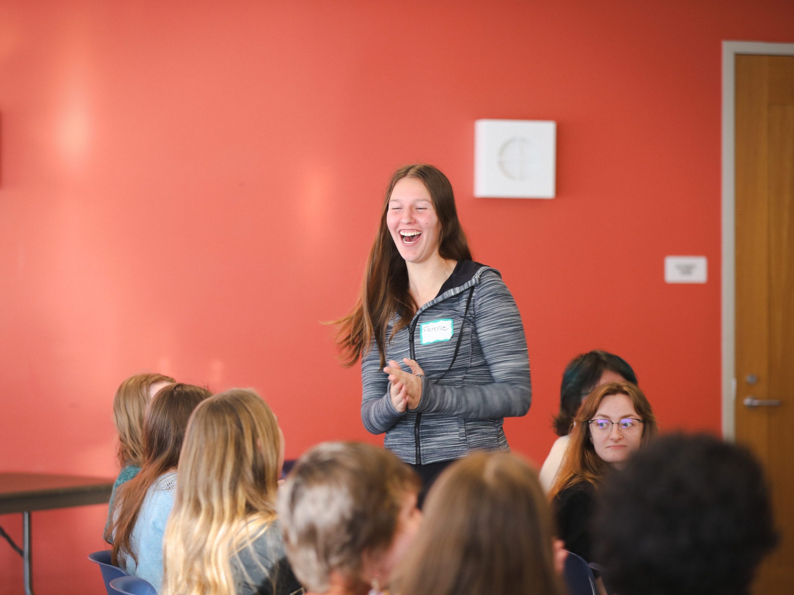Student jumps from seat in celebration as winning team is announced at innovation challenge