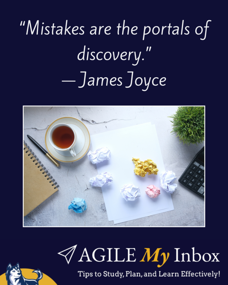 Aerial view of someone's desk with a notebook, pen, cup of tea, calculator, plant, and crumpled pieces of paper