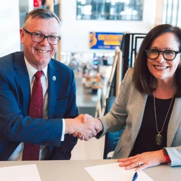 USM President Edmondson and Dag Rune Olsen, rector of The Arctic University of Norway shake hands after signing renewed collaboration agreement.