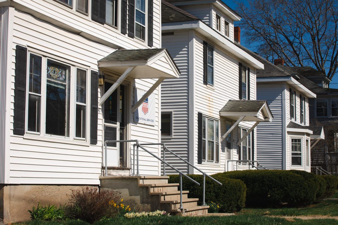 A row of white houses along Exeter Street on the University of Southern Maine's Portland campus.