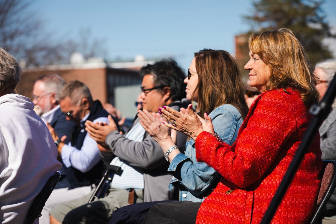 Family members clap during USM's Veterans Row Dedication Ceremony on April 23, 2026.
