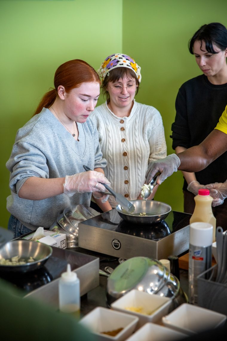 Students following the instructions of Executive Chef Virginia Jordan.