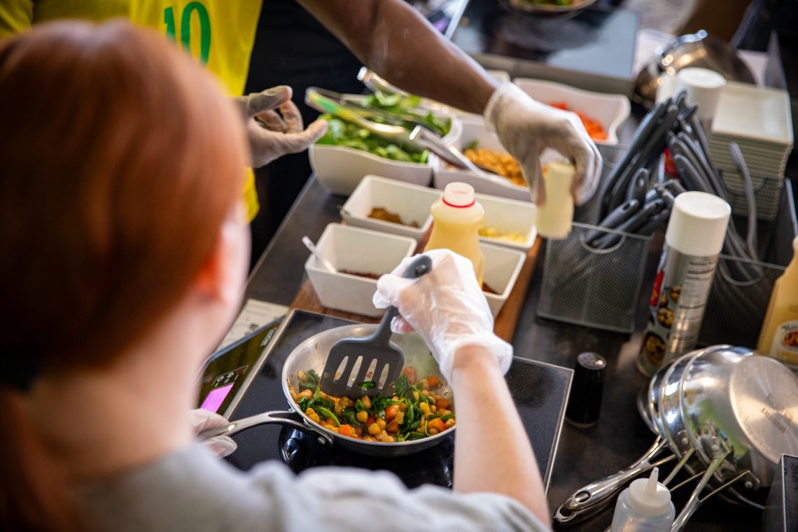 A view of the sauté pan in which a student is preparing a meal.