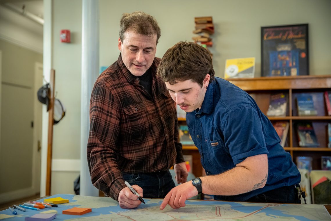 James Levy (left) and Micah Baird (right) adding memories to the Portland Memory map.